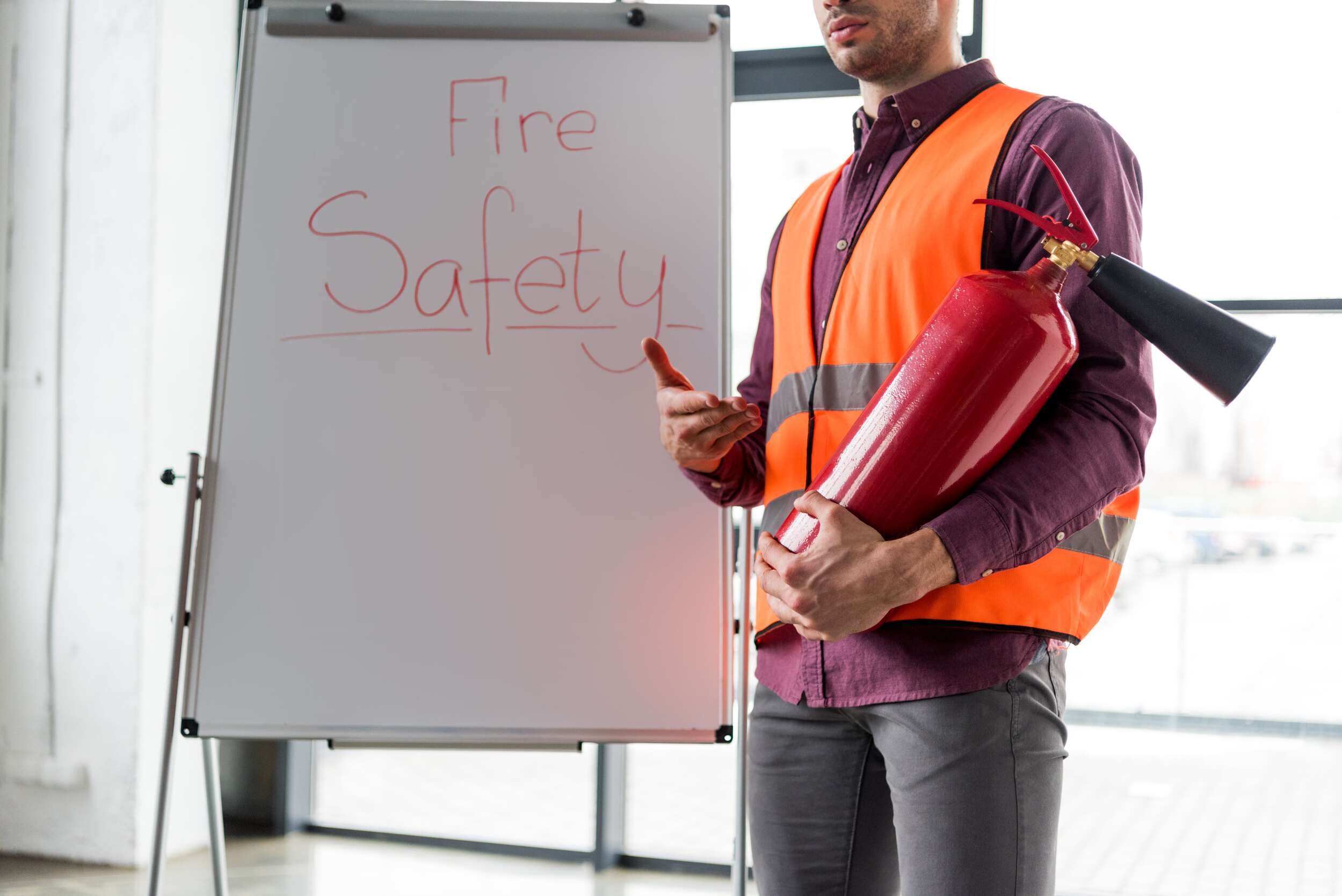 Fire safety presentation with extinguisher.